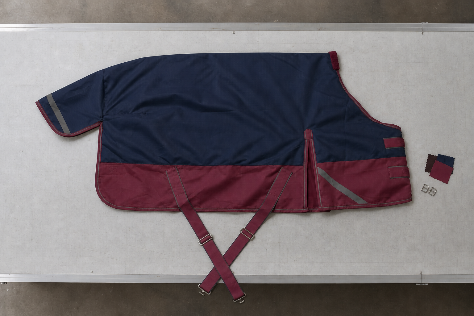 Full-size navy and burgundy horse rug with coordinated physical swatches and hardware